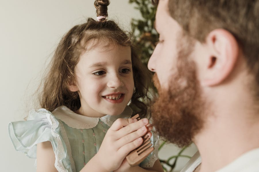 pexels-arina-krasnikova-dad-daughter-hairstyling Pints and Ponytails